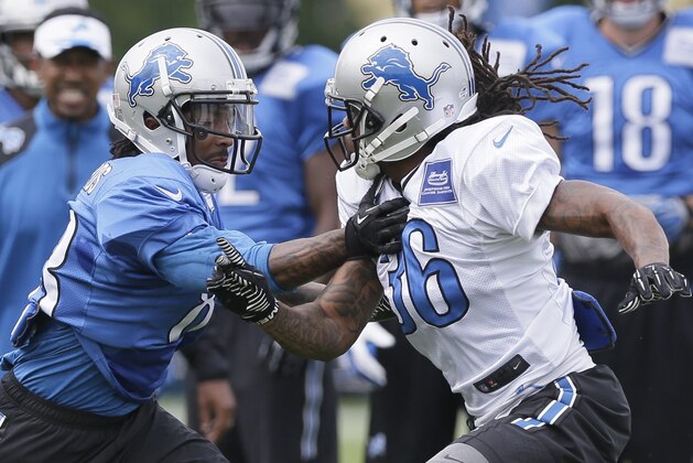 Detroit Lions cornerback Jonte Green (36) covers wide receiver Pat Edwards during an NFL football training camp in Allen Park, Mich., Tuesday, Aug. 5, 2014. (AP Photo/Carlos Osorio)