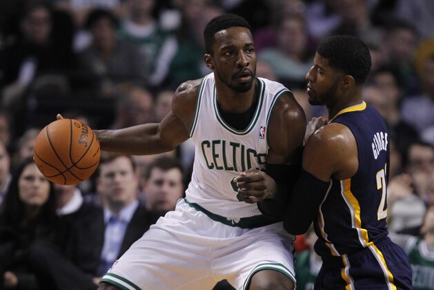 Boston Celtics shooting guard Jeff Green (8) looks to pass against Indiana Pacers small forward Paul George (24) during the first quarter of an NBA basketball game, Friday, Nov. 22, 2013, in Boston. (AP Photo/Charles Krupa)