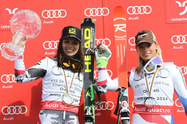 Austria's Anna Fenninger, left, alpine ski World Cup overall winner, poses with Switzerland's Lara Gut, third overall champion, at the alpine ski World Cup finals in Lenzerheide, Switzerland, Sunday, March 16, 2014.  (AP Photo/Armando Trovati)