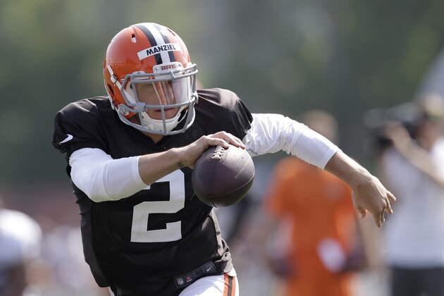 Cleveland Browns quarterback Johnny Manziel runs during practice at the NFL football team's training camp Monday, Aug. 4, 2014, in Berea, Ohio. Manziel has taken his first snaps in training camp with Cleveland's starters. Manziel is trying to beat out Brian Hoyer for the starting job. The former Heisman Trophy winner from Texas A&M had worked exclusively with Cleveland's second-string offense until Monday. (AP Photo/Tony Dejak)