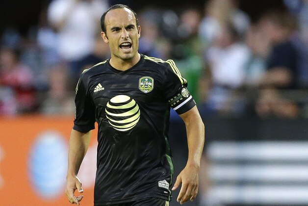 In this Aug. 6, 2014, photo, Los Angeles Galaxy forward Landon Donovan reacts on the pitch after he scored the winning goal of the MLS All-Star match against Bayern Munich in Portland, Ore. Donovan said Thursday, Aug. 7, 2014 that he is retiring from professional soccer at the end of the MLS season. (AP Photo/Ted S. Warren)