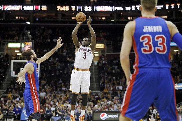 Cleveland Cavaliers' Dion Waiters (3) shoots over Detroit Pistons' Luigi Datome, from Italy,  in an NBA basketball game Wednesday, April 9, 2014, in Cleveland. (AP Photo/Mark Duncan)