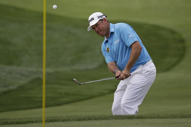 Lee Westwood, of England, hits a chip on the first hole during the first round of the PGA Championship golf tournament at Valhalla Golf Club on Thursday, Aug. 7, 2014, in Louisville, Ky. (AP Photo/David J. Phillip)