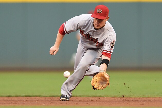CINCINNATI, OH - JULY 29:  Aaron Hill #2 of the Arizona Diamondbacks fields a ground ball in the third inning against the Cincinnati Reds at Great American Ball Park on July 29, 2014 in Cincinnati, Ohio. Cincinnati defeated Arizona 3-0.  (Photo by Jamie Sabau/Getty Images)