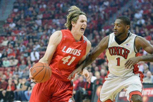 LAS VEGAS, NV - FEBRUARY 19:  Cameron Bairstow #41 of the New Mexico Lobos drives against Roscoe Smith #1 of the UNLV Rebels during their game at the Thomas & Mack Center on February 19, 2014 in Las Vegas, Nevada. New Mexico won 68-56.  (Photo by Ethan Miller/Getty Images)