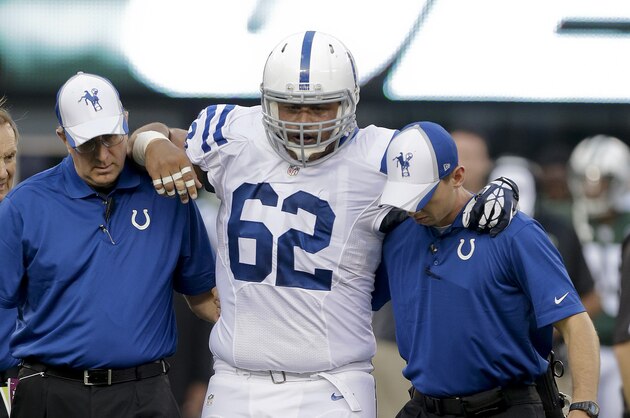 Indianapolis Colts center Khaled Holmes (62) is helped off the field after an injury in the first quarter of an NFL football game against the New York Jets, Thursday, Aug. 7, 2014, in East Rutherford, N.J. (AP Photo/Frank Franklin II)