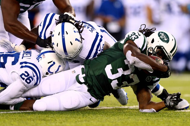 EAST RUTHERFORD, NJ - AUGUST 07: Running back Chris Ivory #33 of the New York Jets carries the ball against the Indianapolis Colts during a preseason game at MetLife Stadium on August 7, 2014 in East Rutherford, New Jersey.  (Photo by Elsa/Getty Images)
