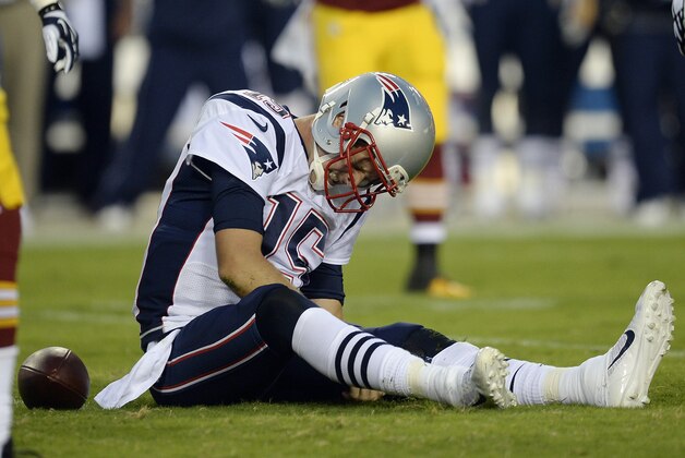 Aug 7, 2014; Landover, MD, USA; New England Patriots quarterback Ryan Mallett (15) sits on field during the first half against the Washington Redskins at FedEx Field. Mandatory Credit: Rafael Suanes-USA TODAY Sports