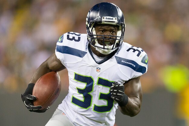 Aug 23, 2013; Green Bay, WI, USA; Seattle Seahawks running back Christine Michael (33) during the game against the Green Bay Packers at Lambeau Field.  Seattle won 17-10.  Mandatory Credit: Jeff Hanisch-USA TODAY Sports