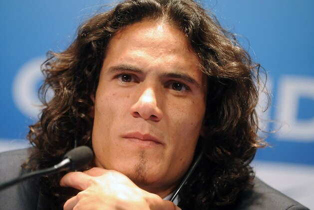 PARIS, FRANCE - JULY 16: Paris Saint-Germain's (PSG) new forward, Edinson Cavani, attends a press conference on July 16, 2013 in Paris, France. Cavani's transfer to Paris Saint-Germain football club is reported to have cost in the region of £55m. (Photo by Antoine Antoniol/Getty Images)