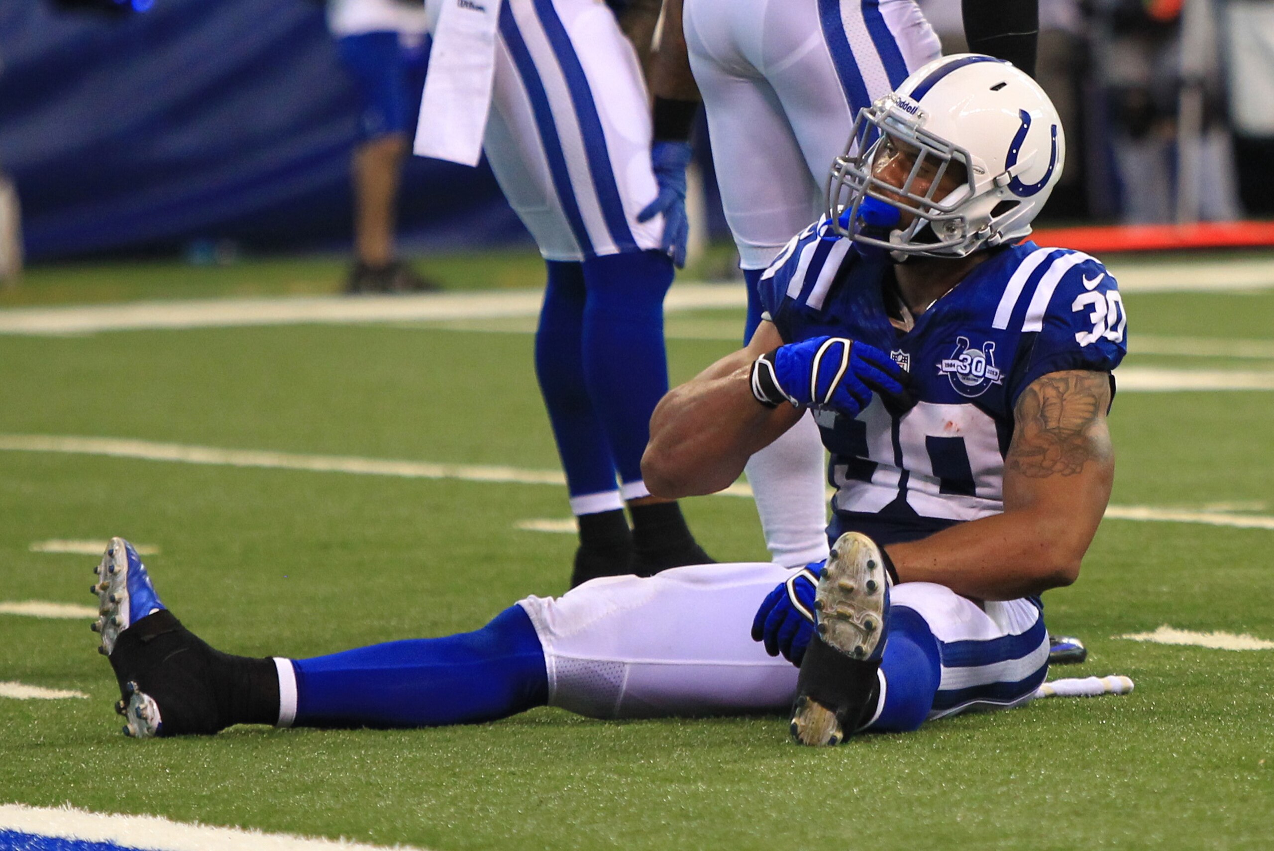 Sep 8, 2013; Indianapolis, IN, USA; Indianapolis Colts free safety LaRon Landry (30) reacts after a play against the Oakland Raiders at Lucas Oil Stadium. Mandatory Credit: Pat Lovell-USA TODAY Sports