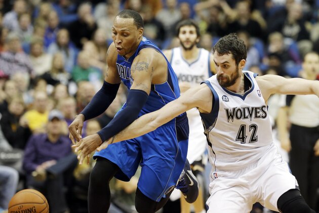 Dallas Mavericks' Shawn Marion, left, and Minnesota Timberwolves' Kevin Love race for the loose ball in the second half of an NBA basketball game, Friday, Nov. 8, 2013 in Minneapolis. The Timberwolves won 116-108. (AP Photo/Jim Mone)