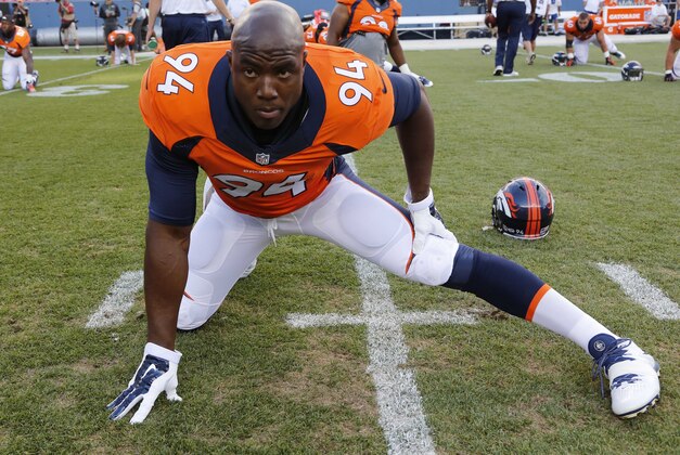 Denver Broncos defensive end DeMarcus Ware stretches prior to an NFL preseason football game, Thursday, Aug. 7, 2014, in Denver. (AP Photo/Jack Dempsey)