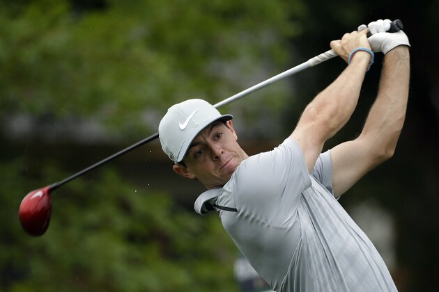 Rory McIlroy, of Northern Ireland, watches his tee shot on the 10th hole during the second round of the PGA Championship golf tournament at Valhalla Golf Club on Friday, Aug. 8, 2014, in Louisville, Ky. (AP Photo/David J. Phillip)