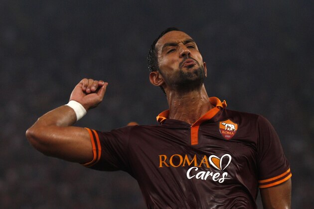 AS Roma's Mehdi Benatia celebrates after scoring during a Serie A soccer match between AS Roma and Bologna at Rome's Olympic stadium, Sunday, Sept. 29, 2013. (AP Photo/Alessandra Tarantino)