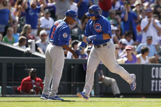 DENVER, CO - AUGUST 07:  Chicago Cubs second baseman Javier Baez #9 gets a high five from third base coach Gary Jones #1 after hitting a two-run home run in the eighth inning against the Colorado Rockies at Coors Field on August 7, 2014 in Denver, Colorado. The Chicago Cubs defeated the Colorado Rockies 6-2.   (Photo by Trevor Brown, Jr./Getty Images)
