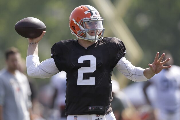 Cleveland Browns quarterback Johnny Manziel passes during practice at the NFL football team's training camp Monday, Aug. 4, 2014, in Berea, Ohio. (AP Photo/Tony Dejak)