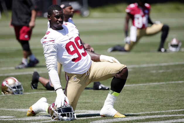 San Francisco 49ers linebacker Aldon Smith (99) stretches during an NFL football training camp on Thursday, July 24, 2014, in Santa Clara, Calif. (AP Photo)