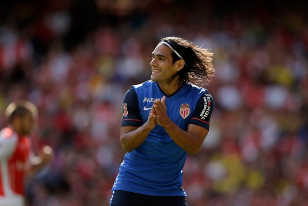 AS Monaco's Radamel Falcao applauds a teammate during the Emirates Cup soccer match between Arsenal and AS Monaco at Arsenal's Emirates Stadium, London, Sunday, Aug. 3, 2014.  (AP Photo/Matt Dunham)