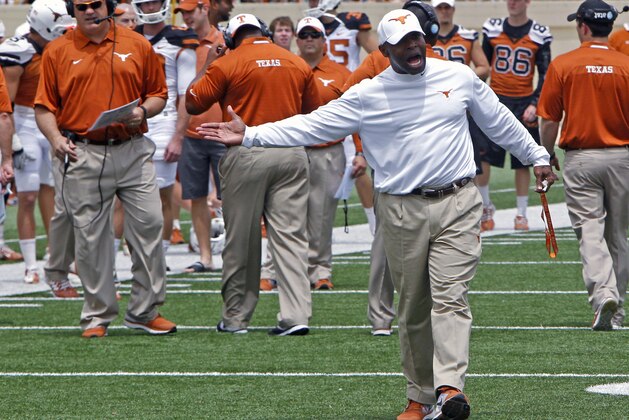 Texas coach Charlie Strong calls out to his players during the first half of the team's Orange and White spring NCAA college football game, Saturday, April 19, 2014, in Austin, Texas.  (AP Photo/Michael Thomas)