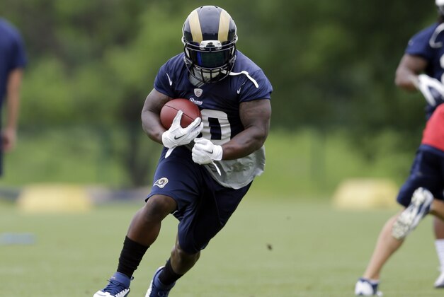 St. Louis Rams running back Zac Stacy runs with the ball during an organized team activity at the NFL football team's practice facility Thursday, June 5, 2014, in St. Louis. (AP Photo/Jeff Roberson)