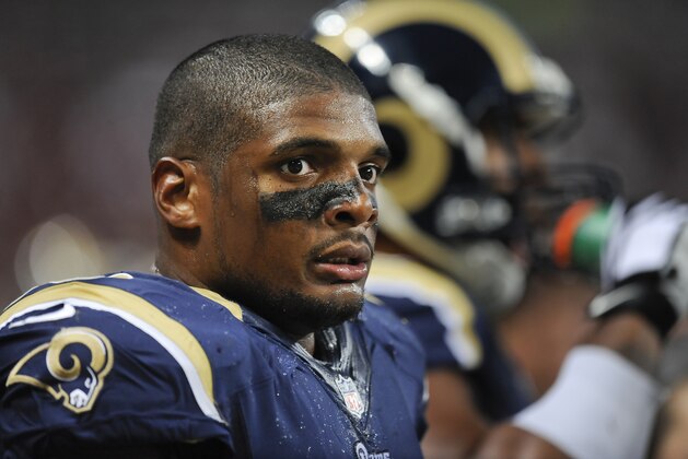 St. Louis Rams defensive end Michael Sam watches from the sideline in the second quarter of a preseason NFL football game between the Rams and the New Orleans Saints Friday, Aug. 8, 2014, in St. Louis. (AP Photo/L.G. Patterson)