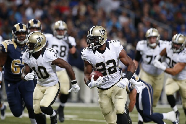 New Orleans Saints running back Mark Ingram (22) runs 22 yards for a touchdown against the St. Louis Rams in the second quarter of a preseason NFL football game Friday, Aug. 8, 2014, in St. Louis. (AP Photo/Scott Kane)