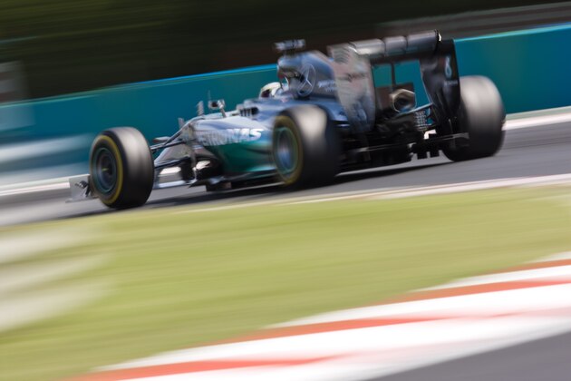 BUDAPEST, HUNGARY - JULY 25:  Lewis Hamilton of Great Britain and Mercedes GP drives during practice ahead of the Hungarian Formula One Grand Prix at Hungaroring on July 25, 2014 in Budapest, Hungary.  (Photo by Drew Gibson/Getty Images)