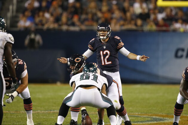 Chicago Bears quarterback David Fales (12) calls a play in the second half of an NFL preseason football game against the Philadelphia Eagles Friday, Aug. 8, 2014, in Chicago. (AP Photo/Charles Rex Arbogast)