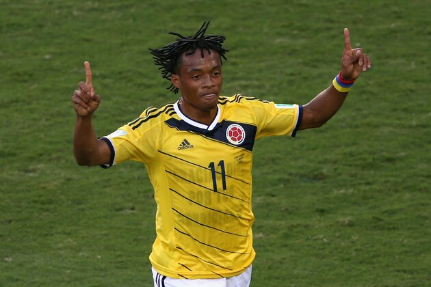 CUIABA, BRAZIL - JUNE 24:  Juan Guillermo Cuadrado of Colombia celebrates scoring his team's first goal after a penalty kick during the 2014 FIFA World Cup Brazil Group C match between Japan and Colombia at Arena Pantanal on June 24, 2014 in Cuiaba, Brazil.  (Photo by Warren Little/Getty Images)