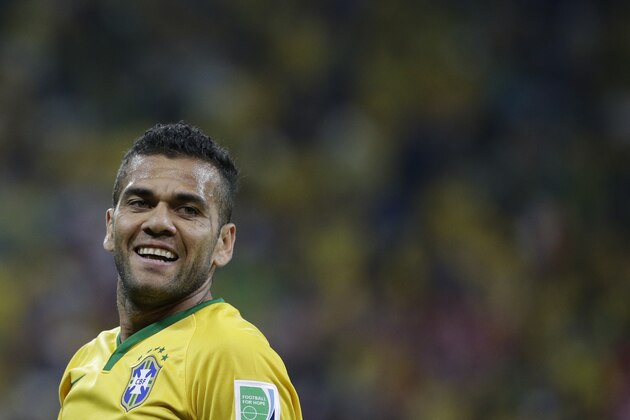 Brazil's Dani Alvess reacts during the group A World Cup soccer match between Brazil and Croatia, the opening game of the tournament, in the Itaquerao Stadium in Sao Paulo, Brazil, Thursday, June 12, 2014.  (AP Photo/Felipe Dana)