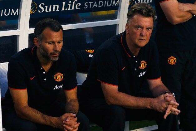 MIAMI GARDENS, FL - AUGUST 04: (L) Ryan Giggs and manager of Manchester United Louis Van Gaal sit on the bench prior to the game against Liverpool in the Guinness International Champions Cup 2014 Final at Sun Life Stadium on August 4, 2014 in Miami Gardens, Florida.  (Photo by Chris Trotman/Getty Images)