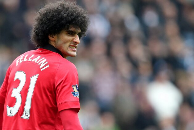 Manchester United's Maroune Fellaini during their English Premier League soccer match against Newcastle United at St James' Park, Newcastle, England, Saturday, April 5, 2014. (AP Photo/Scott Heppell)