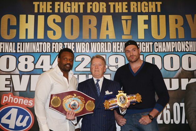 LONDON, ENGLAND - MARCH 17:  Dereck Chisora (left) and Tyson Fury (right) pose with promoter Frank Warren (centre) during a press conference to announce a final eliminator for the WBO world heavyweight chamoionship between Dereck Chisora and Tyson Fury at the Landmark Hotel on March 17, 2014 in London, England.  (Photo by Andrew Redington/Getty Images)