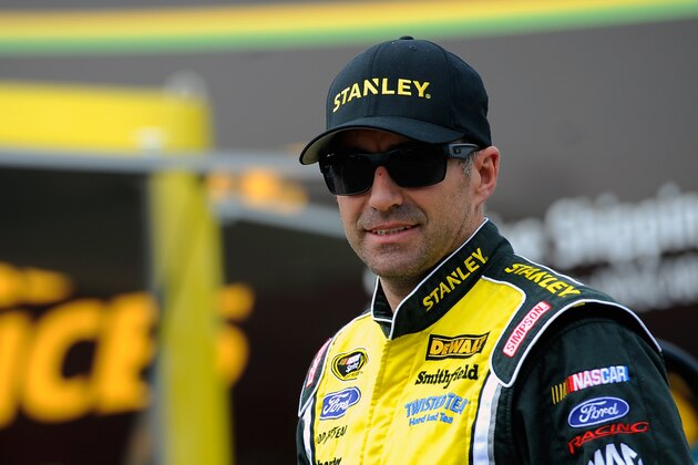 WATKINS GLEN, NY - AUGUST 08:  Marcos Ambrose, driver of the #9 Stanley Ford, looks on in the garage area during practice for the NASCAR Sprint Cup Series Cheez-It 355 at Watkins Glen International on August 8, 2014 in Watkins Glen, New York.  (Photo by Jared C. Tilton/Getty Images)