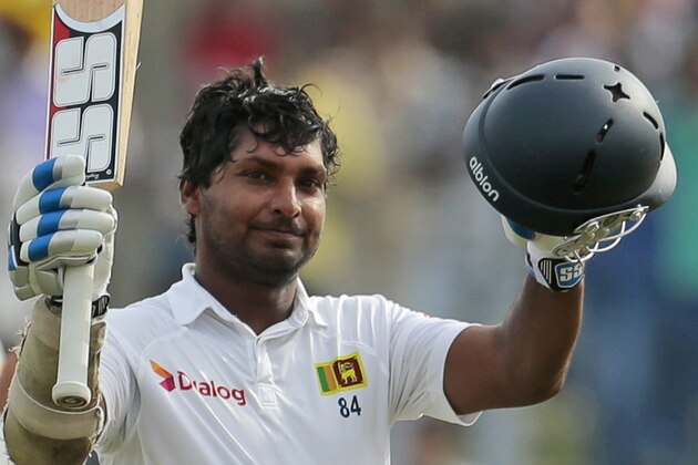 Sri Lankan batsman Kumar Sangakkara celebrates scoring a double century during the fourth day of the first test cricket match between Sri Lanka and Pakistan in Galle, Sri Lanka, Saturday, Aug. 9, 2014. (AP Photo/Eranga Jayawardena)