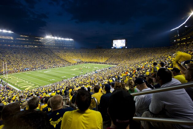 Fans cheer on Michigan and Notre Dame as they begin an NCAA college football game, in Ann Arbor, Mich., Saturday, Sept. 7, 2013. This is only the second ever night game played at Michigan Stadium. Michigan won 41-30. (AP Photo/Tony Ding) Fans cheer on Michigan and Notre Dame as they begin an NCAA college football game, in Ann Arbor, Mich., Saturday, Sept. 7, 2013. This is only the second ever night game played at Michigan Stadium. Michigan won 41-30. (AP Photo/Tony Ding)