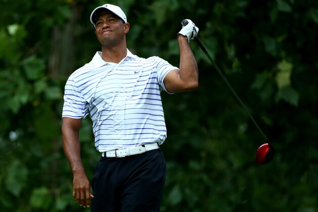 LOUISVILLE, KY - AUGUST 08:  Tiger Woods of the United States reacts on the seventh tee during the second round of the 96th PGA Championship at Valhalla Golf Club on August 8, 2014 in Louisville, Kentucky.  (Photo by Andy Lyons/Getty Images)