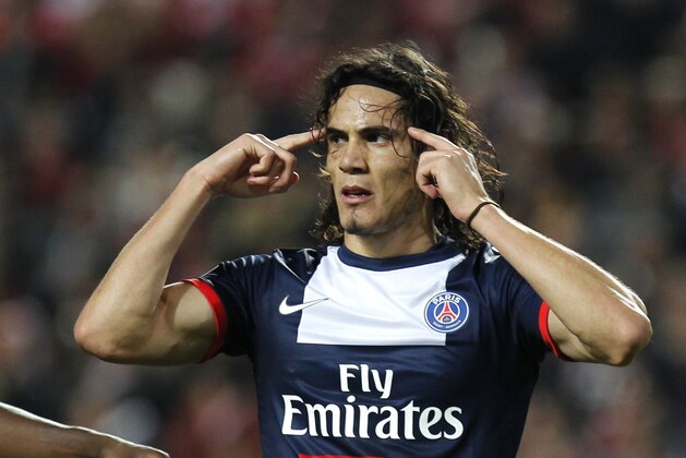 PSG's Edinson Cavani reacts as he celebrates after scoring the opening goal during a Group C Champions League soccer match between Benfica and PSG at the Luz stadium in Lisbon, Tuesday Dec. 10, 2013. (AP Photo/Francisco Seco)