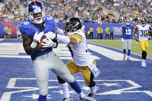 New York Giants wide receiver Corey Washington (6) makes a catch for a touchdown against Pittsburgh Steelers defensive back Isaiah Green (39) in the fourth quarter of a preseason NFL football game, Saturday, Aug. 9, 2014, in East Rutherford, N.J. (AP Photo/Bill Kostroun)