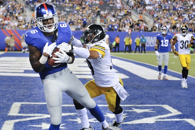 New York Giants wide receiver Corey Washington (6) makes a catch for a touchdown against Pittsburgh Steelers defensive back Isaiah Green (39) in the fourth quarter of a preseason NFL football game, Saturday, Aug. 9, 2014, in East Rutherford, N.J. (AP Photo/Bill Kostroun)