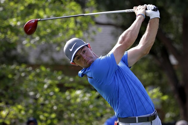 Rory McIlroy, of Northern Ireland, watches his tee shot on the 10th hole during the third round of the PGA Championship golf tournament at Valhalla Golf Club on Saturday, Aug. 9, 2014, in Louisville, Ky. (AP Photo/David J. Phillip)