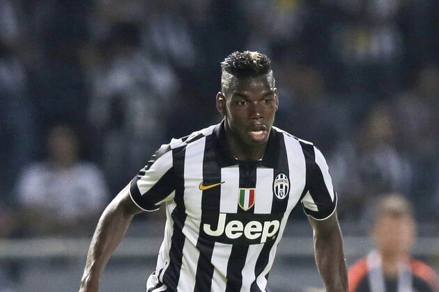 Juventus' Paul Pogba controls the ball during a friendly match against Indonesia Super League All-Starsat Gelora Bung Karno stadium in Jakarta, Indonesia, Wednesday, Aug. 6, 2014. (AP Photo/Dita Alangkara)
