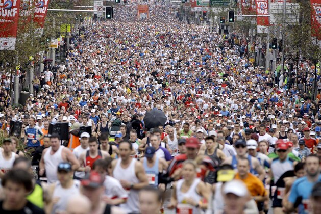 Competitors in the 41st annual City2Surf fun run race up Park Street in Sydney, Australia, Sunday, Aug. 14, 2011. A record 85,000 participants registered to run the 14 kilometers (8.7 miles) from Sydney to Bondi Beach. (AP Photo/Rick Rycroft)