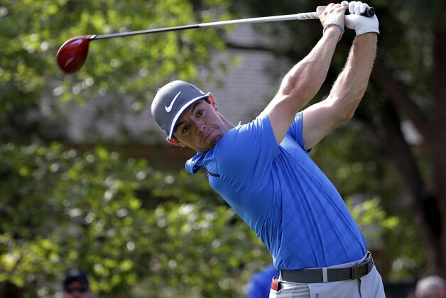 Rory McIlroy, of Northern Ireland, watches his tee shot on the 10th hole during the third round of the PGA Championship golf tournament at Valhalla Golf Club on Saturday, Aug. 9, 2014, in Louisville, Ky. (AP Photo/David J. Phillip)