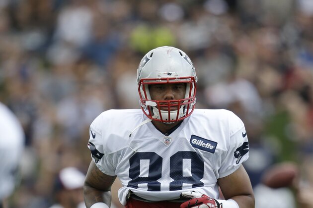 New England Patriots tight end Justin Jones runs on the field during an NFL football training camp practice at Gillette Stadium, Sunday, July 27, 2014, in Foxborough, Mass. (AP Photo/Steven Senne)