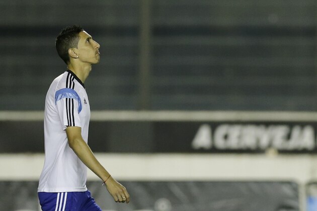 Argentina's Angel di Maria enters the pitch for an official training session at Vasco da Gama Stadium a day before the World Cup soccer final between Germany and Argentina in Rio de Janeiro, Brazil, Saturday, July 12, 2014. (AP Photo/Victor R. Caivano)