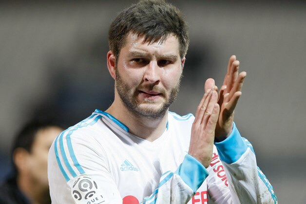 Marseille's French forward Andre-Pierre Gignac applauds supporters , after the League One soccer match against Toulouse,, at the Velodrome Stadium, in Marseille, southern France, Sunday, Feb. 2, 2014. (AP Photo/Claude Paris)