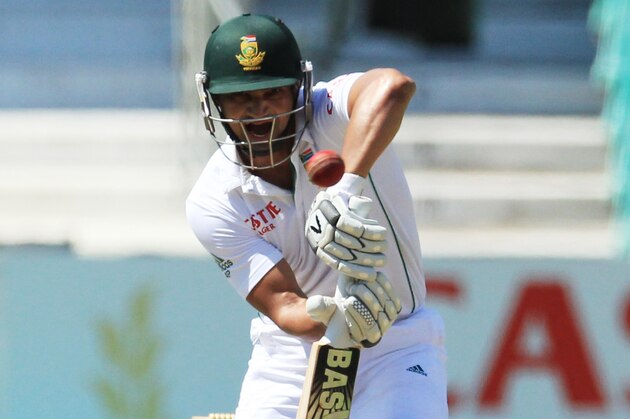 South Africa's batsman Alviro Petersen blocks  a the ball during second day of their cricket test match against India at Kingsmead stadium, Durban, South Africa, Saturday, Dec. 28, 2013. (AP Photo/ Themba Hadebe)