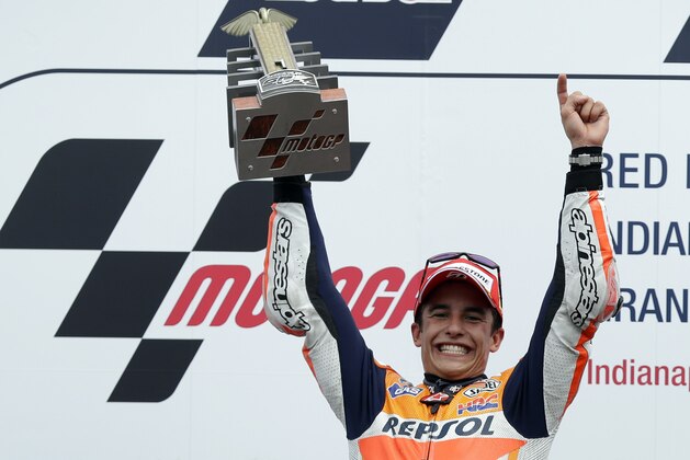 Marc Marquez, of Spain, celebrates after winning the Indianapolis Moto GP motorcycle race at the Indianapolis Motor Speedway in Indianapolis, Sunday, Aug. 10, 2014.  (AP Photo/Michael Conroy)
